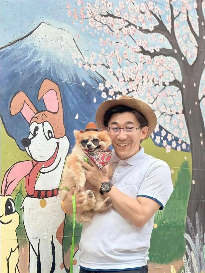 Japan animal hospital's client holding a dog for rabbie vaccine