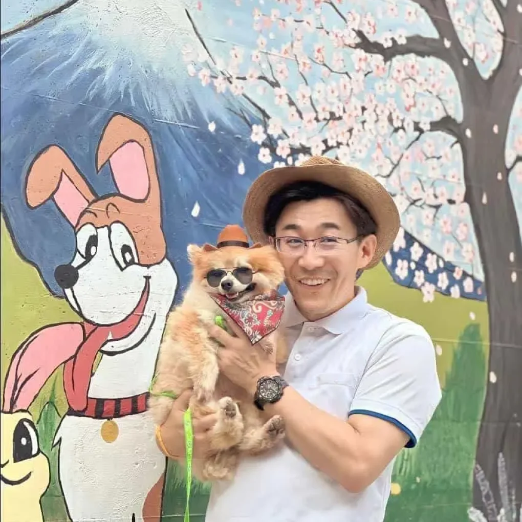 Japan animal hospital's client holding a dog for rabbie vaccine